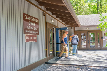 Cades Cove, Tennessee, United States â€“ April 24, 2023: Horizontal shot of tourists leaving...
