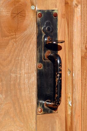 Metal latch on wooden gate.の写真素材