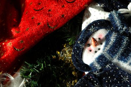 fluffy snowman and santa hat christmas decortationの写真素材