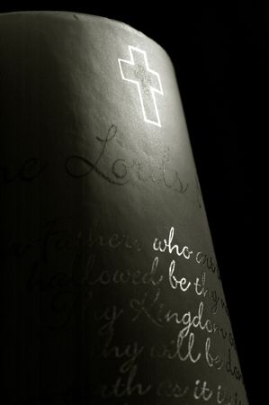 beam of light on cross and candle scripture