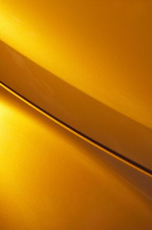 golden glitter curved vehicle panel abstractの写真素材