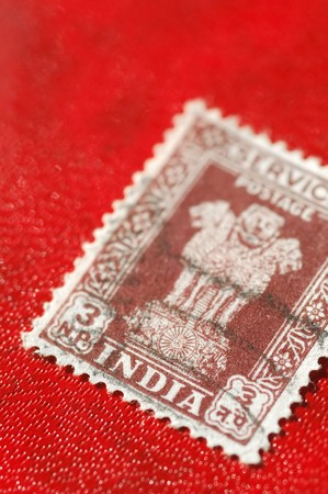 vintage Indian postage stamp on a red backgroundの写真素材