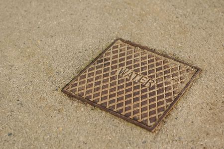 close-up of a water utility drain coverの写真素材