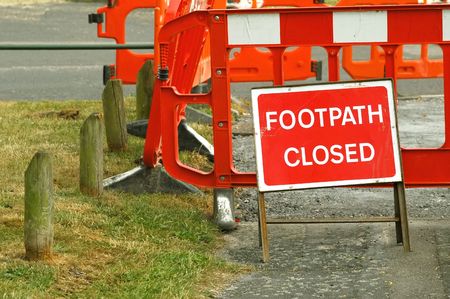 footpath closed by road maintenance barrier signの写真素材