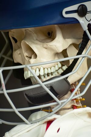 scary skull in a protective sports helmetの写真素材