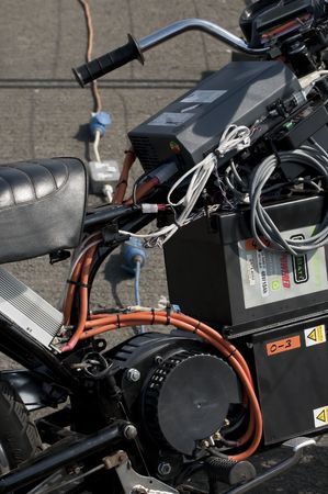 SANTA POD, UK - APRIL 23, 2010: Alternative energy racing at Santa Pod Raceway. Battery powered motorcycle being charged before testing on the quarter mile drag strip. April 23, 2010, Santa Pod, UK.のeditorial素材