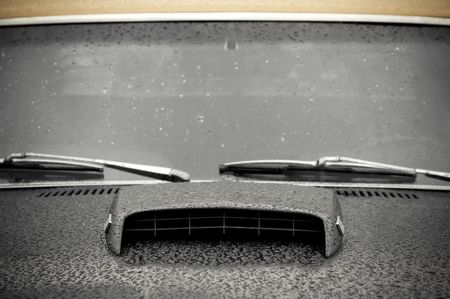 vintage muscle car hood covered in rainの写真素材