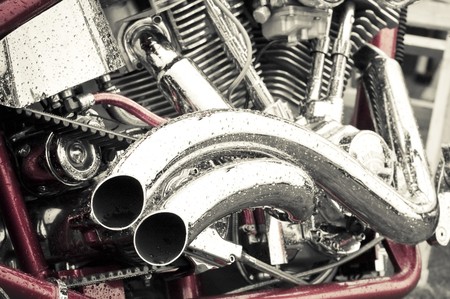 rain soaked red and chrome motorcycle abstract