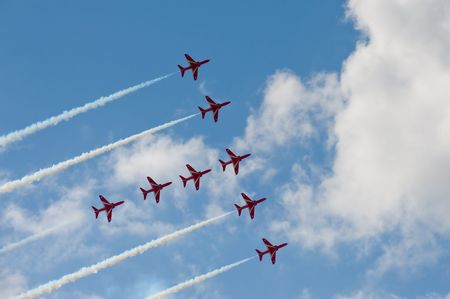 Farnborough International Airshow, UK - July 15, 2010: Precision maneuver by the Red Arrows...