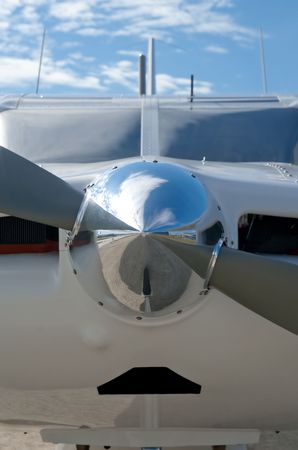 reflections on a chromed light aircraft nose cone