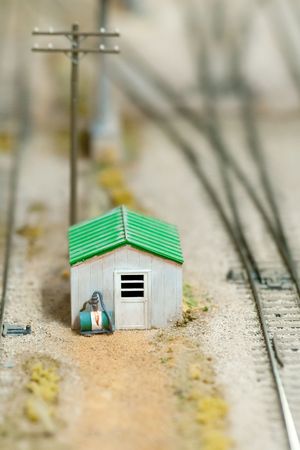 track-side cabin on a miniature train set layout