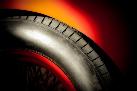 red sports car wheel and tire in a bright spotlightの写真素材