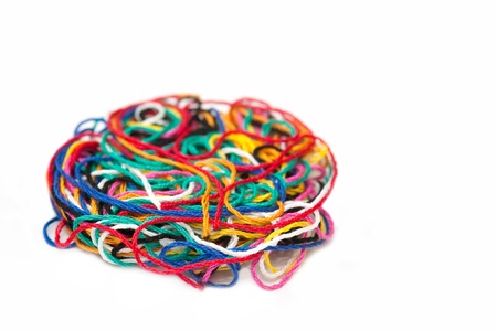 multi-colored needlecraft sewing thread isolated on whiteの写真素材