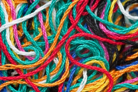 macro background of multi-colored needlecraft embroidery threadの写真素材