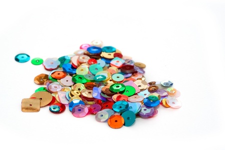 decorative craft sequins on a white backgroundの写真素材
