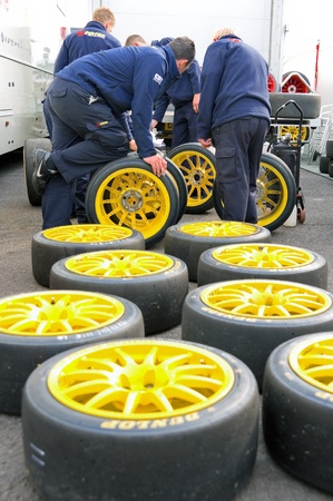 Thruxton, United Kingdom - MAY 1, 2011: Pirtek pit crew making tire choices before racing in the British Touring Car Championships at Thruxton, UKのeditorial素材