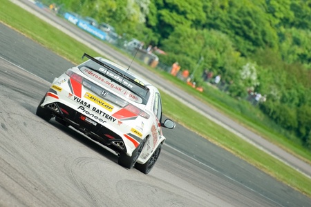 Thruxton, United Kingdom - May 1, 2011: Gordon Shedden in his Honda Racing Civic turbo heading for victory in the British Touring Car Championship at Thruxton, UKのeditorial素材