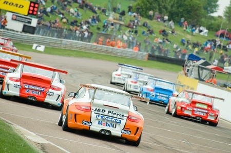 Thruxton, United Kingdom - May 1, 2011: Race cars on the starting grid for a Porsche Carrera Cup...