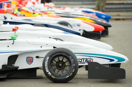 Thruxton, United Kingdom - May 1, 2011: Line of race cars in the Park Firme paddock during the Formula Renault Championships on May 1, 2011 in Thruxton, UK.のeditorial素材