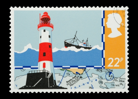 United Kingdom - circa 1985: Mail stamp printed in the UK featuring a lighthouse and maritime charts.のeditorial素材