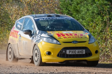 Aldershot, UK - November 3, 2012: Alex Parpottas driving a Ford Fiesta on the Pavillion stage of the MSA Tempest Rally near Aldershot, UKのeditorial素材