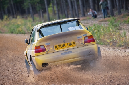 Bramshill Forest, UK - November 3, 2012: Tony Bird driving a Ford Escort Cosworth on the Warren stage of the MSA Tempest Rally in Bramshill Forest, UKのeditorial素材
