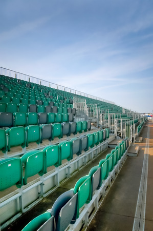 empty grandstand seating at an outdoor sports venueのeditorial素材