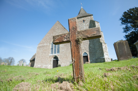 old wooden cross in a church graveyardの写真素材