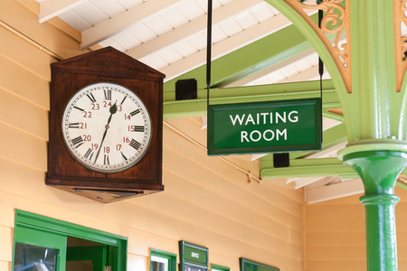 vintage public amenity waiting room and large antique clockの写真素材