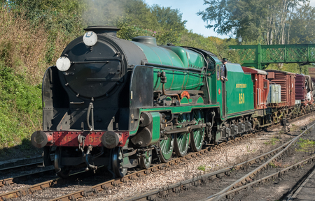 Ropley, UK - 19 September, 2015: The Lord Nelson 850 vintage steam locomotive arriving at the Mid-Hants Watercress railway station of Ropley, UKのeditorial素材