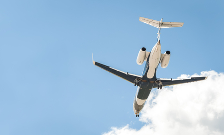 small corporate business jet on landing approach with copy-spaceの写真素材