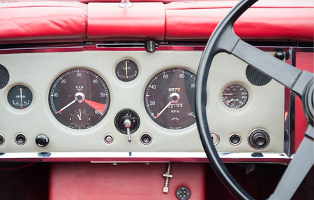 vintage automobile dashboard and steering wheel