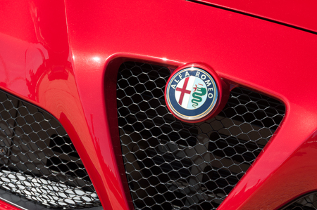 Laverstoke, UK - August 25, 2016: Closeup of a vehicle badge and grille on an Alfa Romeo sports-car.のeditorial素材