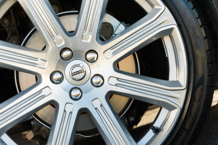 Laverstoke, UK - August 25, 2016: Closeup of chromed wheel and brake disc assembly on a vehicle manufactured by Swedish company Volvoのeditorial素材