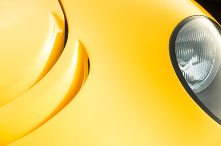 closeup abstract of golden paintwork on a luxury sports-car