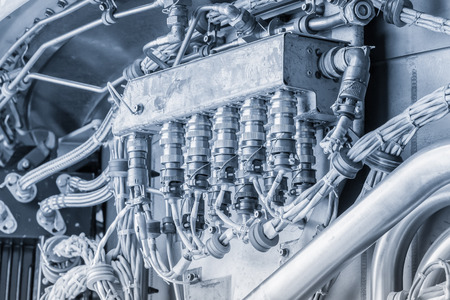 blue toned electrical connection box inside a modern jet engine
