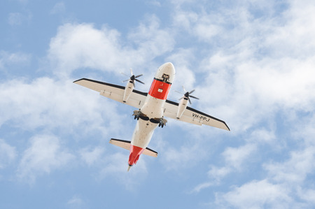 Farnborough, UK - July 16, 2018: Dornier 328 propeller aircraft, operated by the Australian Maritime Safety Authority landing at Farnborough Airport, UKのeditorial素材