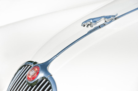 Yateley, UK - May 7, 2018: Chromed vehicle insignia on a vintage Jaguar XK 150 automobile.のeditorial素材