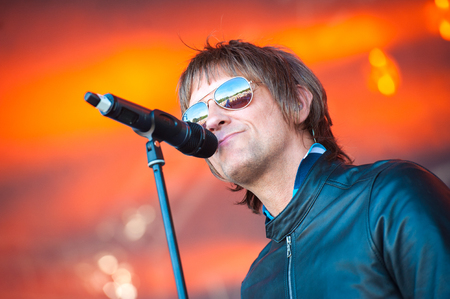 Yateley, UK - June 24, 2018: Tribute artist Paul Higginson performing as Oasis frontman Liam Gallagher at the Gig On The Green Festival, Yateley, UKのeditorial素材