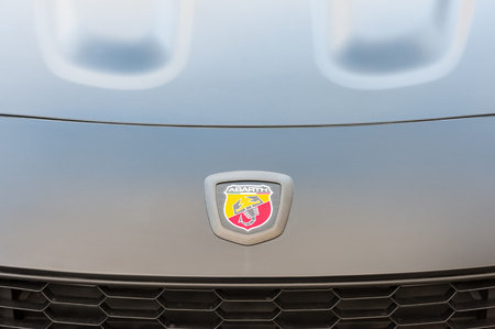Hook, UK - January 1, 2019:  Close-up vehicle badge insignia on the hood of an Abarth sports-car...