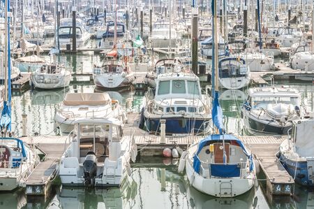 crowded boating marina with lots of yachts and small pleasure craft - no product identification or...