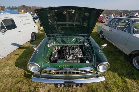 Engine bay of a classic British Ford Cortina MK1 at a meeting of vintage vehicles in Rushmoor, UK - April 19, 2019のeditorial素材