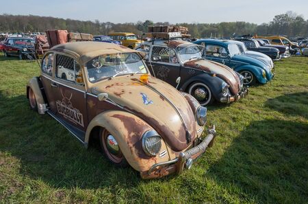 Line of vintage Volkswagen Beetle cars at a meeting of classic vehicles in Rushmoor, UK - April 19, 2019のeditorial素材