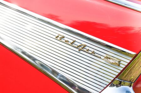 Closeup of a vintage Chevrolet Bel Air vehicle badge in Rushmoor, UK - April 19, 2019のeditorial素材