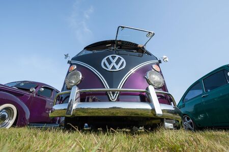 Fully restored purple split-screen Volkswagen Camper van at a meeting of classic vehicles in Rushmoor, UK - April 19, 2019のeditorial素材