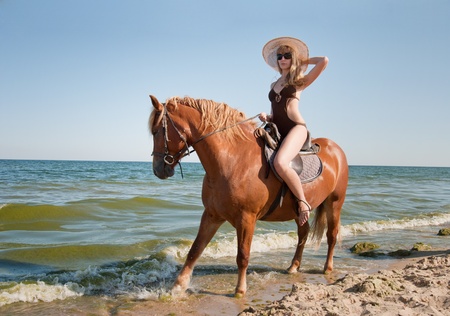 Girl rides on horse の写真素材