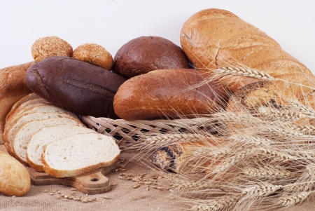 composition of bread and wheat spikeletsの写真素材