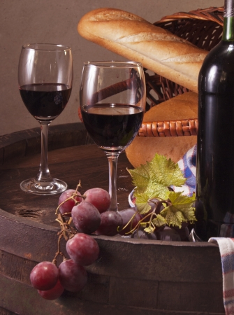 Still life with wine barrel, bread and cheeseの写真素材