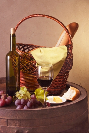 Still life with wine barrel, grapes and vineの写真素材