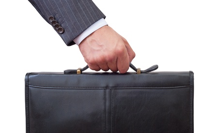 Casual Man holding in hand a briefcase . Isolated on white background